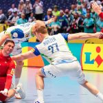 Switzerland's left back #44 Mehdi Ben Romdhane (L), Switzerland's pivot #23 Lukas Laube (R) and Slovenia's pivot #27 Kristjan Horzen (C) vie for the ball during the men's EHF Euro 2026 preliminary round handball match Switzerland vs Slovenia in Oslo, Norway, on January 18, 2026.