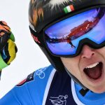 Italy's Federica Brignone reacts in the finish area after competing in on the podium of the women's super-G event during the Milano Cortina 2026 Winter Olympic Games at the Tofane Alpine Skiing Centre in Cortina d’Ampezzo on February 12, 2026.