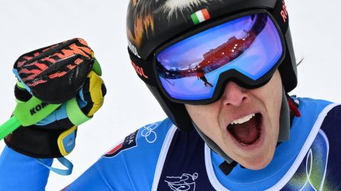 Italy's Federica Brignone reacts in the finish area after competing in on the podium of the women's super-G event during the Milano Cortina 2026 Winter Olympic Games at the Tofane Alpine Skiing Centre in Cortina d’Ampezzo on February 12, 2026.