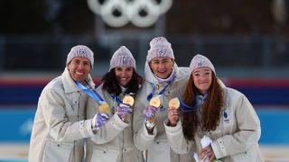 Gold medallists France's Eric Perrot, France's Quentin Fillon Maillet, France's Lou Jeanmonnot, France's Julia Simon pose on the podium of the mixed biathlon 4 x 6km relay event during the Milano Cortina 2026 Winter Olympic Games at the Anterselva Biathlon Arena (Sudtirol Arena) in Anterselva (Val Pusteria) on February 8, 2026.