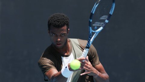 France’s Giovanni Mpetshi Perricard hits a return against Argentina’s Sebastian Baez during their men's singles match on day three of the Australian Open tennis tournament in Melbourne on January 20, 2026.