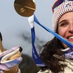 Gold medallist France's Julia Simon poses after the victory ceremony of the women's biathlon 15km individual event during the Milano Cortina 2026 Winter Olympic Games at the Anterselva Biathlon Arena (Sudtirol Arena) in Anterselva (Val Pusteria) on February 11, 2026.