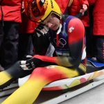Germany's Max Langenhan reacts in the finish area after winning the luge men's singles run 4 at Cortina Sliding Centre during the Milano Cortina 2026 Winter Olympic Games in Cortina d'Ampezzo on February 8, 2026.