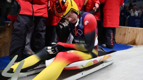 Germany's Max Langenhan reacts in the finish area after winning the luge men's singles run 4 at Cortina Sliding Centre during the Milano Cortina 2026 Winter Olympic Games in Cortina d'Ampezzo on February 8, 2026.