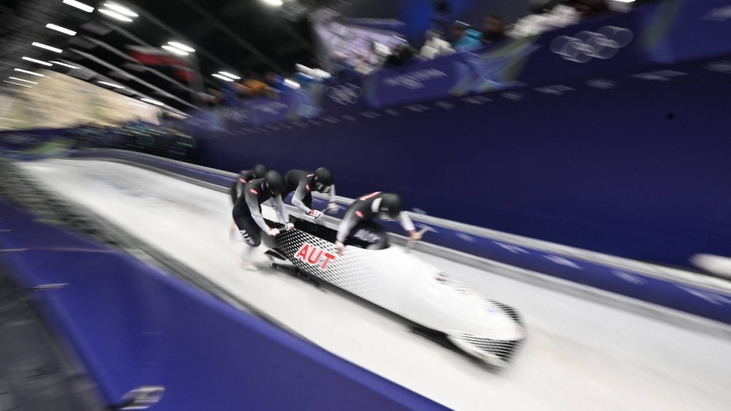 Austria's Jakob Mandlbauer, Austria's Daniel Bertschler, Austria's Sebastian Mitterer and Austria's Daiyehan Nichols-Bardi compete in the bobsleigh men's 4-man heat 1 at Cortina Sliding Centre during the Milano Cortina 2026 Winter Olympic Games in Cortina d'Ampezzo on February 21, 2026.