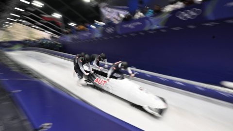Austria's Jakob Mandlbauer, Austria's Daniel Bertschler, Austria's Sebastian Mitterer and Austria's Daiyehan Nichols-Bardi compete in the bobsleigh men's 4-man heat 1 at Cortina Sliding Centre during the Milano Cortina 2026 Winter Olympic Games in Cortina d'Ampezzo on February 21, 2026.