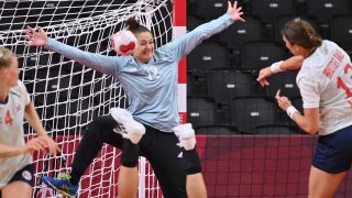 Hungary's goalkeeper Melinda Szikora (L) tries to stop a shot during the women's quarterfinal handball match between Norway and Hungary of the Tokyo 2020 Olympic Games at the Yoyogi National Stadium in Tokyo on August 4, 2021.