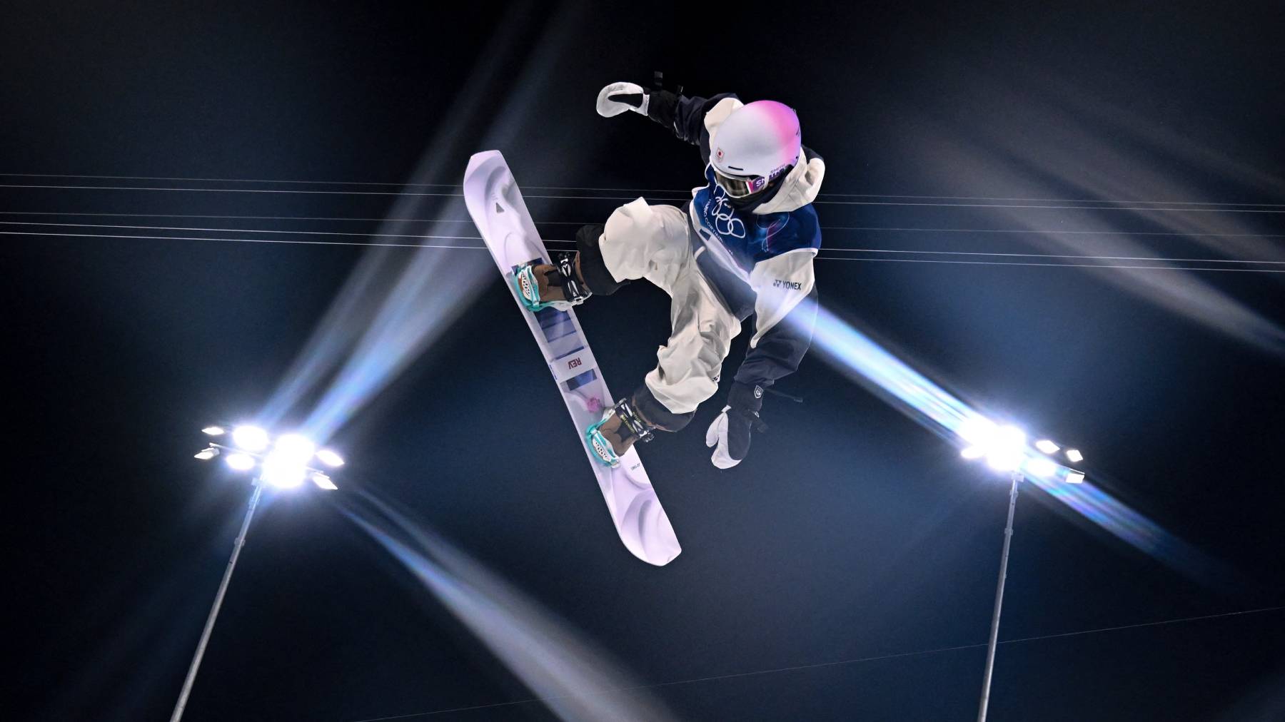 Japan's Yuto Totsuka competes in the snowboard men's halfpipe final run 1 during the Milano Cortina 2026 Winter Olympic Games at Livigno Snow Park, in Livigno (Valtellina), on February 13, 2026.