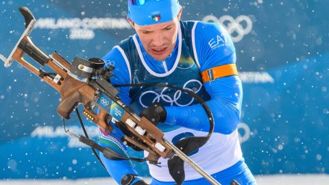 Italy's Tommaso Giacomel competes at the shooting range during the men's biathlon 15km mass start event during the Milano Cortina 2026 Winter Olympic Games at the Anterselva Biathlon Arena (Sudtirol Arena) in Anterselva (Val Pusteria) on February 20, 2026. Italian biathlete Tommaso Giacomel has undergone heart surgery and must rest for two weeks after dropping out when leading the mass start race at the Winter Olympics, the Italian Winter Sports Federation (FISI) announced on February 24, 2026.
