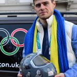 Ukrainian skeleton athlete Vladyslav Heraskevych poses with his helmet after a hearing at the Court of Arbitration for Sport (TAS) in Milan on February 13, 2026. Heraskevych was barred from the Milan-Cortina Games after refusing to back down from wearing a helmet adorned with pictures of Ukrainian sportsmen and women killed since Russian invaded in 2022.