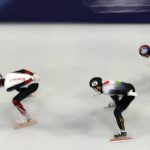MILAN, ITALY - FEBRUARY 10: William Dandjinou of Team Canada, Wonjun Moon of Team Hungary and Dong Min Shin of Team Republic of Korea compete in heat 5 of the Short Track Speed Skating Men's 1000m on day four of the Milano Cortina 2026 Winter Olympic games at Milano Ice Skating Arena on February 10, 2026 in Milan, Italy. (Photo by Jared C. Tilton/Getty Images)