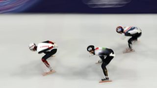 MILAN, ITALY - FEBRUARY 10: William Dandjinou of Team Canada, Wonjun Moon of Team Hungary and Dong Min Shin of Team Republic of Korea compete in heat 5 of the Short Track Speed Skating Men's 1000m on day four of the Milano Cortina 2026 Winter Olympic games at Milano Ice Skating Arena on February 10, 2026 in Milan, Italy. (Photo by Jared C. Tilton/Getty Images)