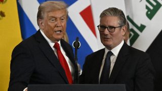 US President Donald Trump stands next to Britain's Prime Minister Keir Starmer as he delivers a statement during a summit on Gaza in Sharm el-Sheikh on October 13, 2025. Trump landed in Egypt on October 13 for a summit on Gaza, following a lightning visit to Israel after a ceasefire he brokered entered into force.