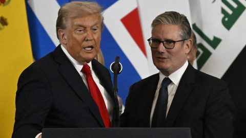 US President Donald Trump stands next to Britain's Prime Minister Keir Starmer as he delivers a statement during a summit on Gaza in Sharm el-Sheikh on October 13, 2025. Trump landed in Egypt on October 13 for a summit on Gaza, following a lightning visit to Israel after a ceasefire he brokered entered into force.