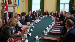 Britain's Prime Minister Keir Starmer (centre L) speaks to mark to the fourth anniversary of Russia's full-scale invasion of Ukraine, during a cabinet meeting at Downing Street in London on February 24, 2026. (Photo by Kin Cheung / POOL / AFP)