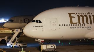 An Emirates Airbus A380 sits parked at Los Angeles International Airport (LAX) in Los Angeles, California on March 2, 2026, after its return flight to Dubai International Airport (DXB) was cancelled due to the war in the Middle East. Air routes closed, airports damaged and hundreds of thousands of passengers stranded: the new war in the Middle East has again highlighted the global aviation sector's vulnerability to geopolitical upheaval. (Photo by Patrick T. Fallon / AFP)