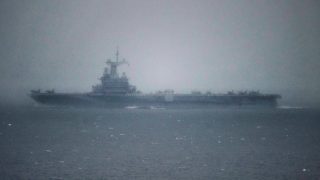The French aircraft carrier Charles-de-Gaulle is seen as it passes through the Strait of Gibraltar off the coast of southern Spain in Tarifa, on March 6, 2026.