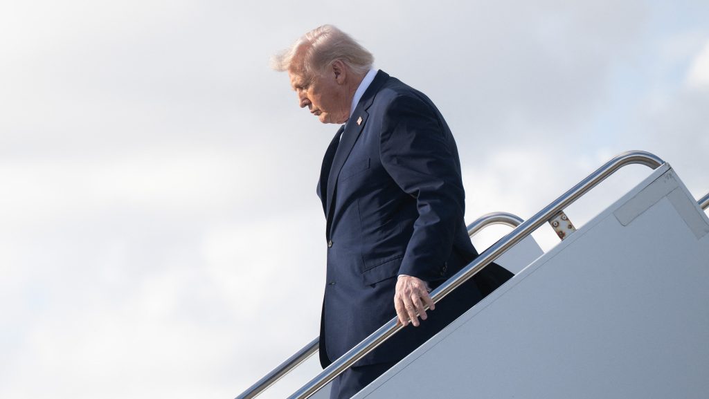US President Donald Trump disembarks Air Force One at Palm Beach International Airport in West Palm Beach, Florida, on March 20, 2026, en route to his Mar-a-Lago resort. (Photo by SAUL LOEB / AFP)