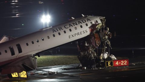 An Air Canada Express CRJ-900 sits on the runway after colliding with a Port Authority fire truck at LaGuardia Airport in New York, on March 23, 2026. Air Canada Express flight AC8646 originated from Montreal and collided with the fire truck during landing. (Photo by ANGELA WEISS / AFP)