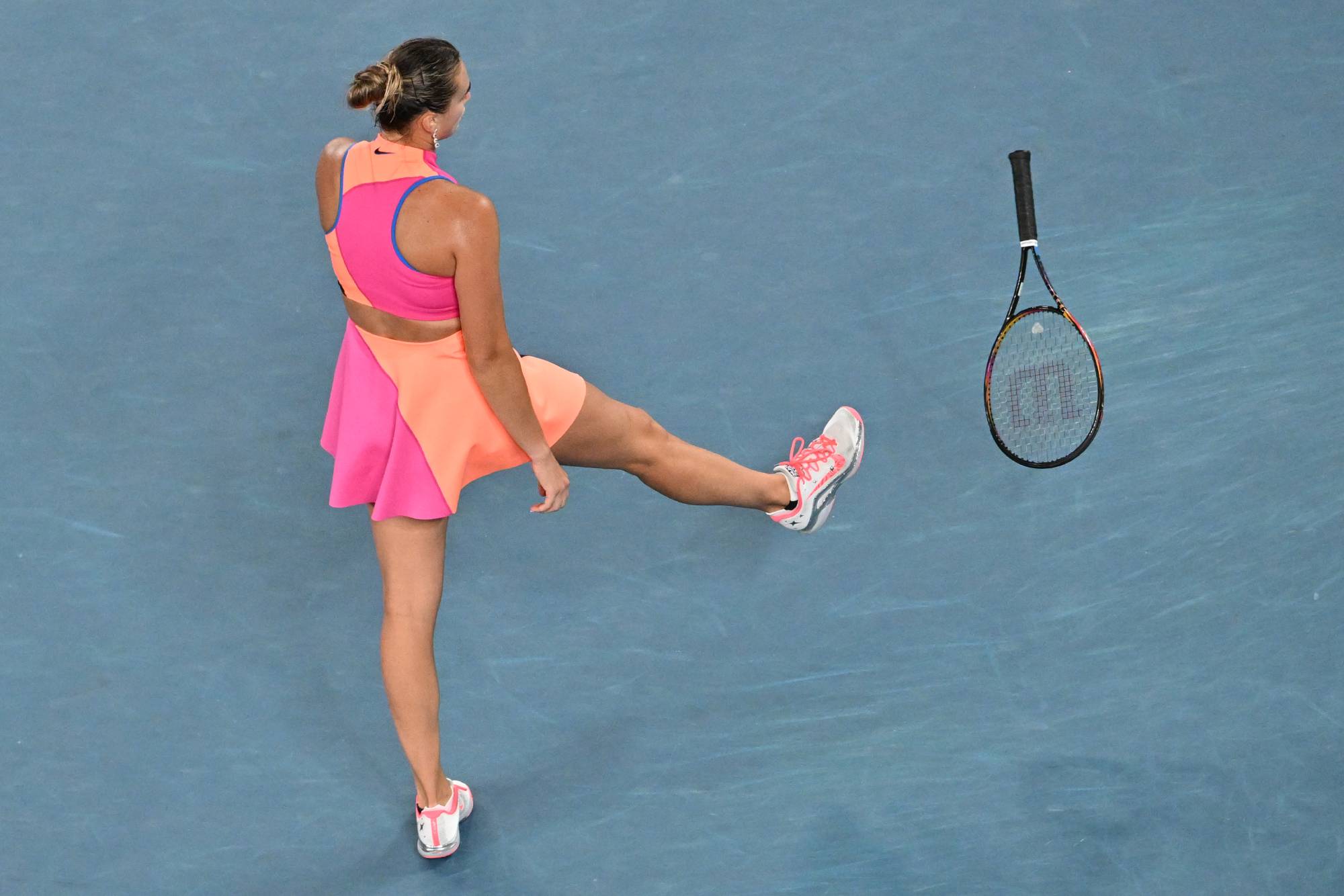 Belarus' Aryna Sabalenka throws her racquet after a point against Kazakhstan's Elena Rybakina during their women's singles final match on day fourteen of the Australian Open tennis tournament in Melbourne on January 31, 2026.