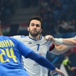 France's left back Romain Lagarde (C), Ukraine's left back Dmitro Horiha (L) and Ukraine's Dmytro Ilchenko (R) vie for the ball during the Men's European Handball Championship preliminary round match between France and Ukraine in Szeged, Hungary on January 15, 2022.
