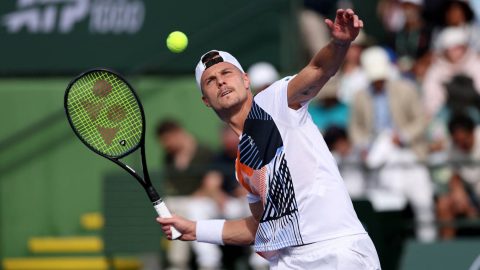 INDIAN WELLS, CALIFORNIA - MARCH 06: Marton Fucsovics of Hungary hits the ball into the crowd in celebration after his straight sets victory against Lorenzo Musetti of Italy in their second round match of the BNP Paribas Open at Indian Wells Tennis Garden on March 06, 2026 in Indian Wells, California. Clive Brunskill/Getty Images/AFP