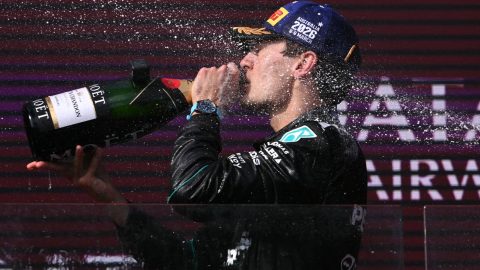driver George Russell drinks champagne as he celebrates on the podium after winning the Formula One Australian Grand Prix at the Albert Park Circuit in Melbourne on March 8, 2026.