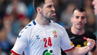 16 January 2024, Bavaria, Munich: Handball: European Championship, Serbia - Montenegro, preliminary round, Group C, match day 3 in the Olympic Hall. Lazar Kukic of Serbia celebrates after scoring a goal. Photo: Sven Hoppe/dpa