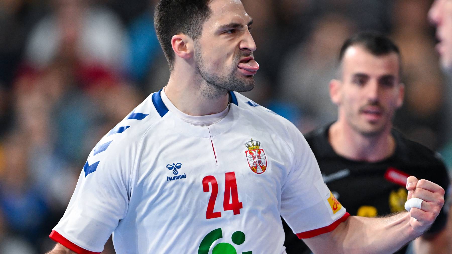 16 January 2024, Bavaria, Munich: Handball: European Championship, Serbia - Montenegro, preliminary round, Group C, match day 3 in the Olympic Hall. Lazar Kukic of Serbia celebrates after scoring a goal. Photo: Sven Hoppe/dpa