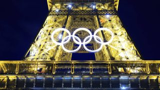 The Olympic rings mounted on the Eiffel Tower is illuminated in Paris on June 28, 2024. The Summer Games will kick off from July 26 to August 11 in France's capital and the iconic monument was decorated with a recycled steel display of the Olympic iconic five-ring logo.( The Yomiuri Shimbun )