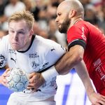 13 April 2025, North Rhine-Westphalia, Cologne: Handball: DHB Cup, THW Kiel - MT Melsungen, Final Four, Final, Lanxess Arena. Melsungen's Adrian Sipos (r) tries to prevent Kiel's Eric Johansson from taking a shot. Photo: Marius Becker/dpa