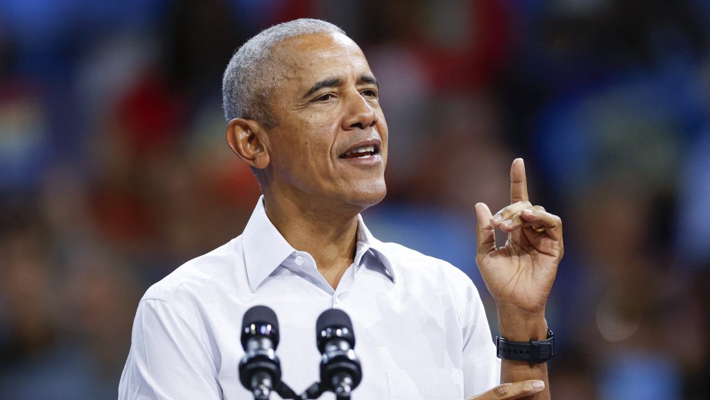 Former US President Barack Obama gestures as he speaks at a campaign rally with Minnesota Governor and Democratic vice presidential candidate Tim Walz in support of Vice President and Democratic presidential candidate Kamala Harris at Alliant Center in Madison, Wisconsin, on October 22, 2024. (Photo by KAMIL KRZACZYNSKI / AFP)