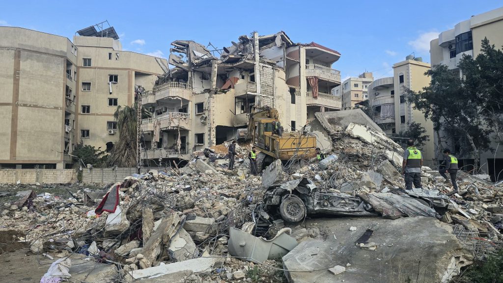 First responders work at the site of an Israeli airstrike in the southern Lebanese city of Tyre on April 8, 2026. The Israeli military warned residents of Tyre to evacuate on April 8 as it continued to target the Iran-backed Hezbollah group. Earlier in the day, Israel said it supported the two-week ceasefire deal between the United States and Iran but maintained the deal "does not include Lebanon", where it has been fighting Hezbollah. (Photo by Kawnat HAJU / AFP)