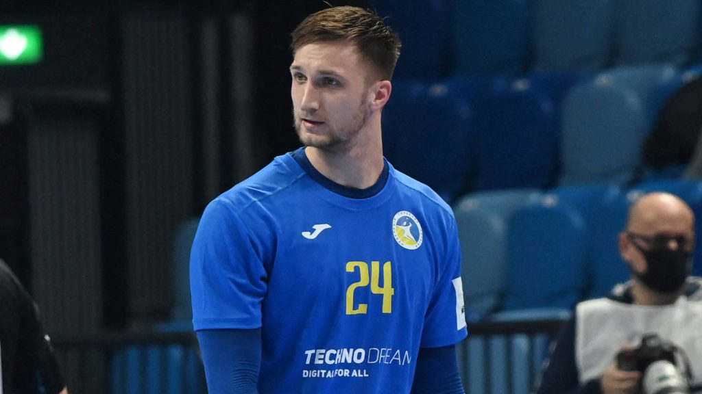 Ukraine's Dmytro Horiha (R) is shown a red card during the Men's European Handball Championship preliminary round match between France and Ukraine in Szeged, Hungary on January 15, 2022.