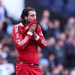 MANCHESTER, ENGLAND - APRIL 4: A dejected Dominik Szoboszlai of Liverpool at full time during the Emirates FA Cup Quarter Final match between Manchester City and Liverpool on April 4, 2026 in Manchester, England. (Photo by Robbie Jay Barratt - AMA/Getty Images)