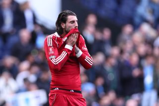 MANCHESTER, ENGLAND - APRIL 4: A dejected Dominik Szoboszlai of Liverpool at full time during the Emirates FA Cup Quarter Final match between Manchester City and Liverpool on April 4, 2026 in Manchester, England. (Photo by Robbie Jay Barratt - AMA/Getty Images)