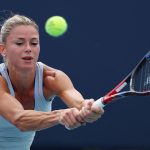 MIAMI GARDENS, FLORIDA - MARCH 20: Camila Giorgi of Italy returns a shot against Magdalena Frech of Poland during their match on Day 5 of the Miami Open at Hard Rock Stadium on March 20, 2024 in Miami Gardens, Florida. Al Bello/Getty Images/AFP