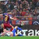 Barcelona's Polish forward #09 Robert Lewandowski and Atletico Madrid's Uruguayan defender #02 Jose Gimenez fight for the ball during the Spanish league football match between Club Atletico de Madrid and FC Barcelona at Metropolitano Stadium in Madrid on April 4, 2026.