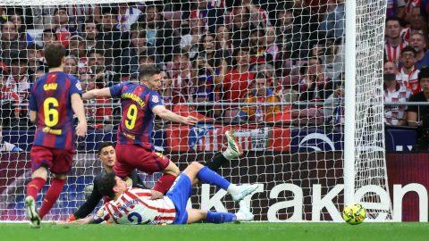 Barcelona's Polish forward #09 Robert Lewandowski and Atletico Madrid's Uruguayan defender #02 Jose Gimenez fight for the ball during the Spanish league football match between Club Atletico de Madrid and FC Barcelona at Metropolitano Stadium in Madrid on April 4, 2026.