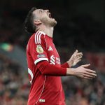 Liverpool's Scottish defender #26 Andrew Robertson reacts after a bad cross during the English Premier League football match between Liverpool and Tottenham Hotspur at Anfield in Liverpool, north west England on March 15, 2026.