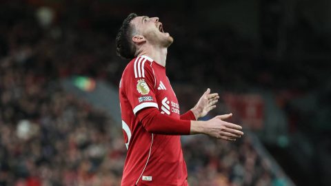 Liverpool's Scottish defender #26 Andrew Robertson reacts after a bad cross during the English Premier League football match between Liverpool and Tottenham Hotspur at Anfield in Liverpool, north west England on March 15, 2026.