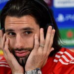 Liverpool's Hungarian midfielder #08 Dominik Szoboszlai attends a press conference at Anfield stadium in Liverpool, north-west England on April 13, 2026, on the eve of their UEFA Champions League, quarter final second leg football match against Paris Saint-Germain.