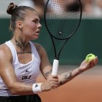 Ukraine's Oleksandra Oliynykova prepares to serve to Diana Shnaider during their women's singles match on day 7 of the French Open tennis tournament at the Roland-Garros Complex in Paris on May 30, 2026.