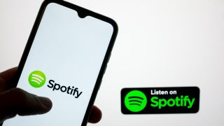 The Spotify logo is being displayed on a smartphone screen and on a computer screen in Athens, Greece, on May 20, 2024. (Photo by Nikolas Kokovlis/NurPhoto) (Photo by Nikolas Kokovlis / NurPhoto via AFP)
