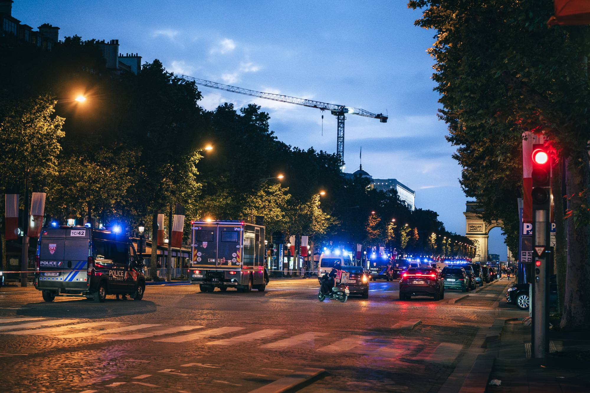 Police vans lined up along the Champs Elysees as part of security measures ahead of the Champions League semifinal between PSG and Bayern in Paris, France, on May 6, 2026. Fourgons de police alignes sur l avenue des Champs Elysees en dispositif de securite en marge de la demi finale de la ligue des Champions entre le PSG et le Bayern a Paris, France le 6 mai 2026.