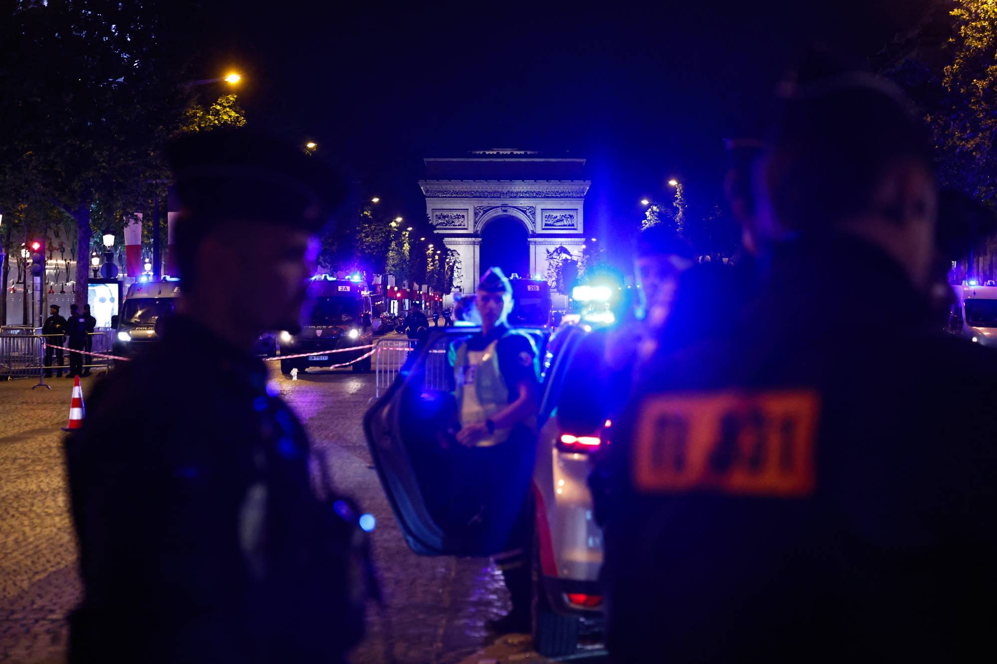 Police officers block the Champs-Elysees following the UEFA Champions League second-leg, semi-final football match between Bayern Munich and Paris Saint-Germain (PSG) on May 6, 2026.