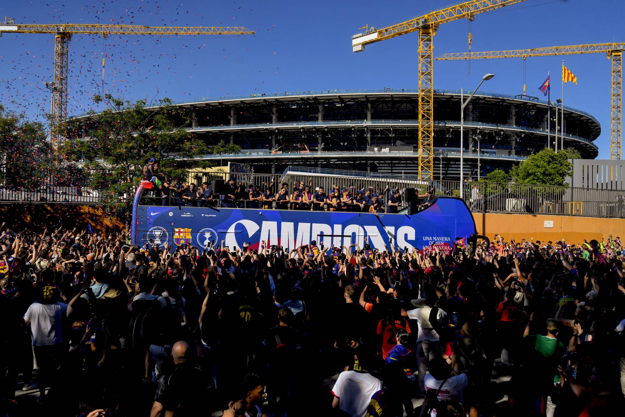 BARCELONA, SPAIN - MAY 11: Players of FC Barcelona celebrate winning the 2025/26 LaLiga and Supercopa de Espana titles with supporters in the streets of Barcelona, Spain, on May 11, 2026. Adria Puig / Anadolu (Photo by Adria Puig / Anadolu via AFP)