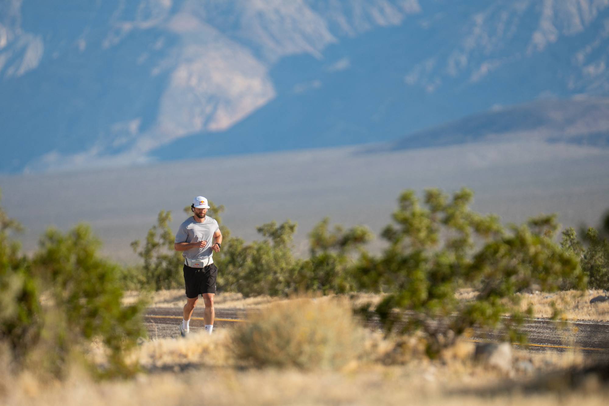 German ultrarunner Arda Saatçi completed a 604.6 km run from Death Valley to Santa Monica in 123 hours, overcoming extreme heat, sleep deprivation and nearly 6,000 metres of elevation gain during his latest “Cyborg Season” challenge. Millions followed the livestreamed endurance feat as Saatçi battled dehydration and hallucinations before reaching Santa Monica Pier. // Red Bull athlete Arda Saatçi running during 2026 Red Bull Cyborg Season Ultra 600 in Death Valley, CA, USA on May 6, 2026. // Cameron Moon / Red Bull Content Pool (Photo by Cameron Moon / Red Bull Content Pool via AFP)
