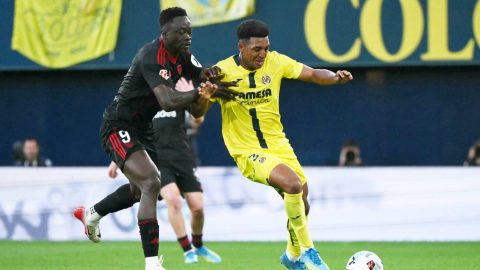 Sevilla's Nigerian forward #09 Akor Jerome Adams challenges Villarreal's US defender #03 Alexander Freeman during the Spanish league football match between Villarreal CF and Sevilla FC at La Ceramica Stadium in Vila-real on May 12, 2026.