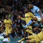Manchester City's Ghanaian midfielder #42 Antoine Semenyo jumps a challenge from Crystal Palace's US defender #26 Chris Richards during the English Premier League football match between Manchester City and Crystal Palace at the Etihad Stadium in Manchester, north west England, on May 13, 2026.